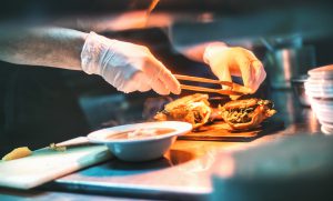 Chef finishing a meal.